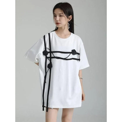 A stylish black and white floral half-sleeve casual t-shirt with a classic round neckline, perfect for everyday wear.