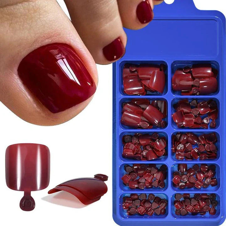 Elegant short square press-on toenails in vibrant pink, red, and nude shades for a polished and convenient pedicure