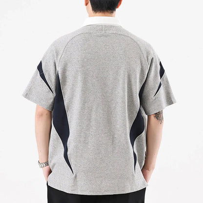 Melange grey polo shirt with contrast stitching, designed and made in Britain for comfortable summer wear