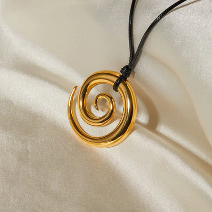 Exquisite spiral circle pendant necklace with 18K gold plating and black rope chain, a versatile accessory for the modern British woman.
