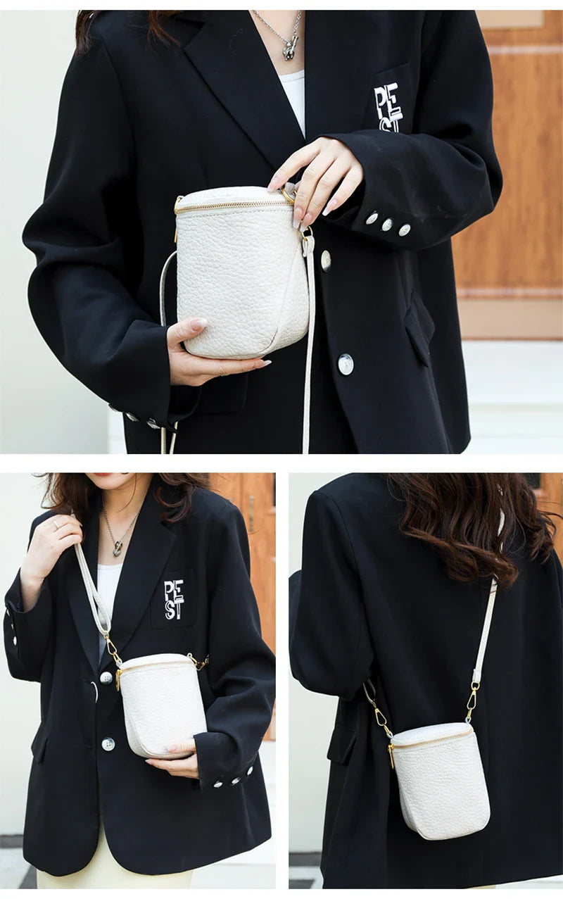Elegant leather crossbody bag with adjustable strap, multiple pockets, and premium cowhide construction for the modern British woman