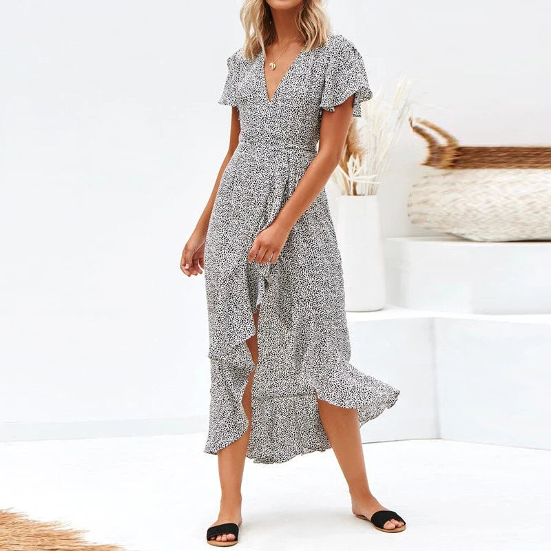 Elegant V-neck short-sleeved lace dress in a flattering silhouette, featuring delicate lace details and a blend of European and British fashion influences.