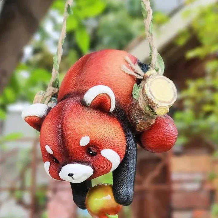 Charming resin raccoon statue climbing a decorative rope, adding a whimsical and nature-inspired touch to your outdoor or indoor spaces