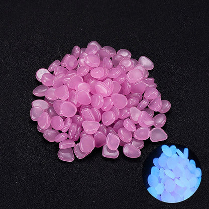 Enchanting glow-in-the-dark decorative pebbles illuminating a garden pathway at night