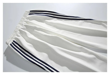 Stylish striped sports trousers in a relaxed, mid-waist design for versatile leisure and athletic wear