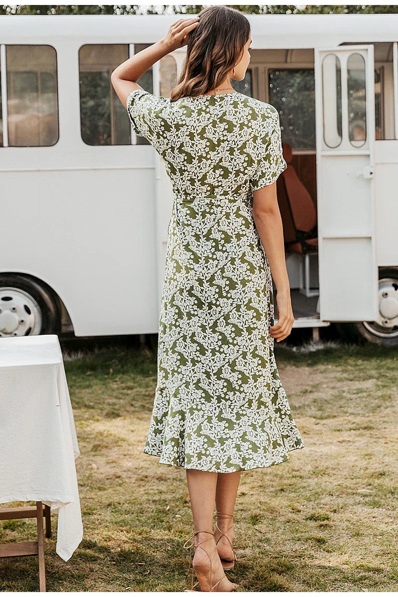 Elegant floral lace ruffle dress in yellow, featuring a cascading ruffled skirt and delicate lace overlay for a refined, British-inspired look.