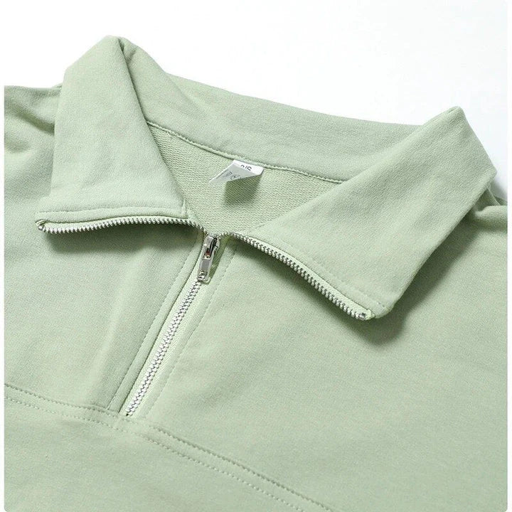 A cosy, oversized cotton pullover with a stylish zipper accent, perfect for casual autumn and winter wear.