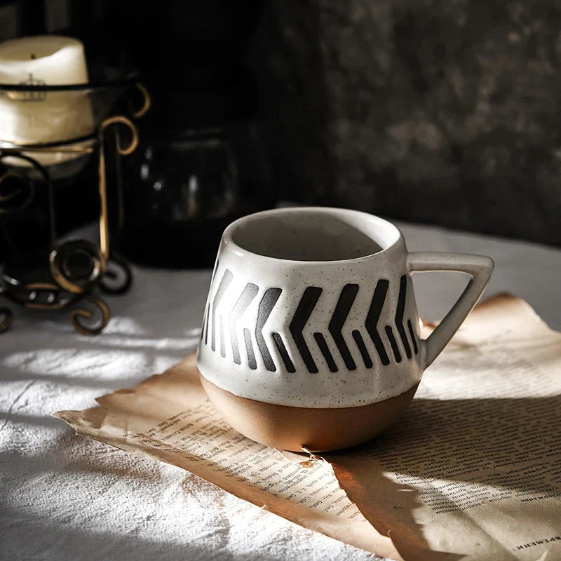 A hand-painted ceramic mug featuring a unique Nordic-inspired design, perfect for enjoying coffee, tea, or other beverages