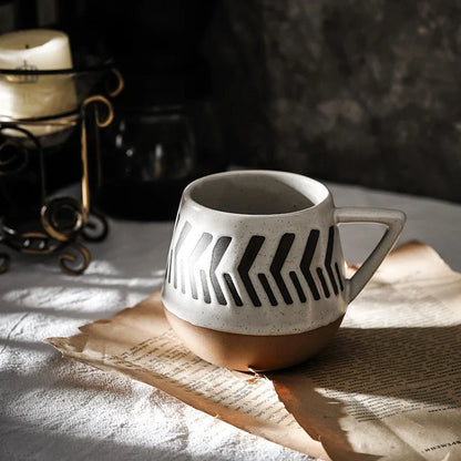 A hand-painted ceramic mug featuring a unique Nordic-inspired design, perfect for enjoying coffee, tea, or other beverages