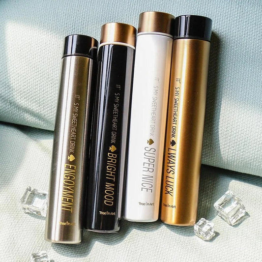 Elegant and slim stainless steel travel thermos in gold colour, with a straight cup design for comfortable one-handed use