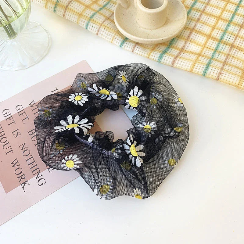 Handmade floral elastic hair bands with soft chiffon fabric and vibrant embroidered daisy patterns, perfect for enhancing everyday style in the UK.