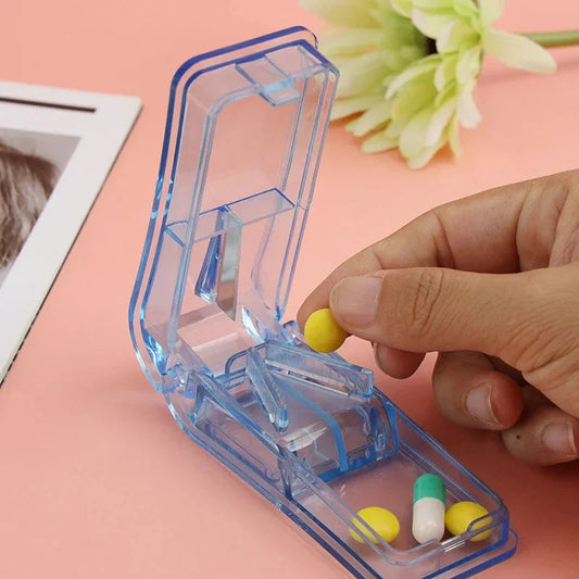 Compact Pill Splitter and Storage Organizer with Orange Colour, Featuring Precision Cutting Blade and Built-in Storage Compartment