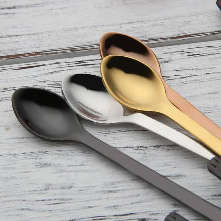 A silver cat-shaped stainless steel coffee spoon with a polished finish