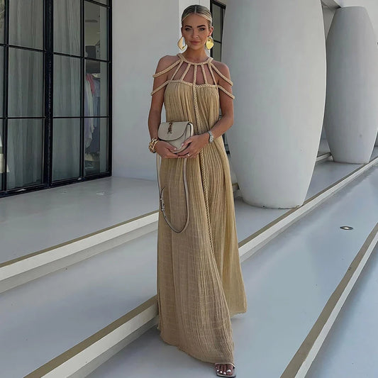 Elegant knitted beach dress with hollow-out design, perfect for British summer style