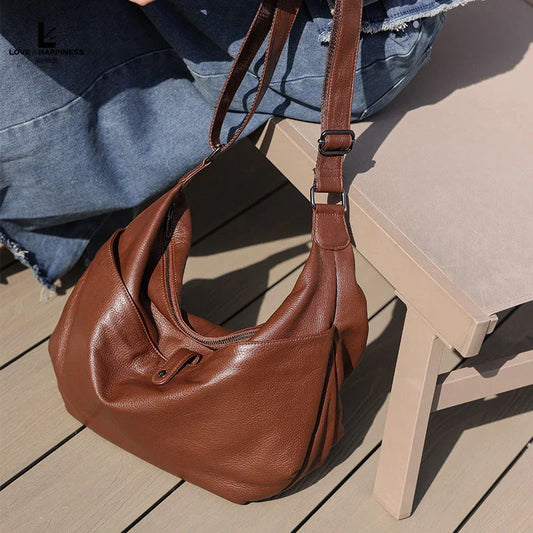 High-quality genuine leather crossbody hobo bag for women with a unique stone pattern and ample interior storage