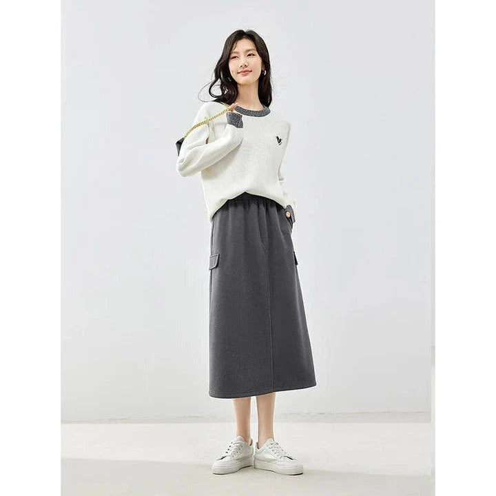 Elegant dark grey midi skirt with subtle sequin detailing, suitable for autumn and winter wear