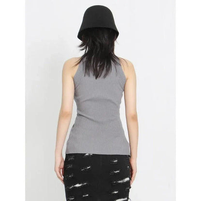 Elegant and versatile knitted sleeveless tank top with a unique hollow-out design, perfect for chic British style