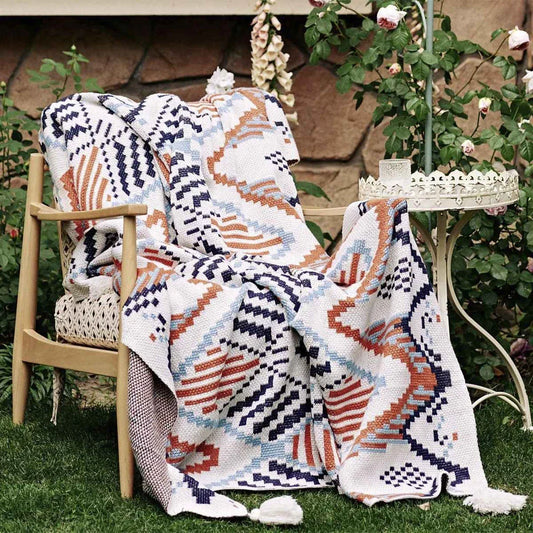 Boho geometric design cotton blanket in various sizes, perfect for indoor and outdoor use