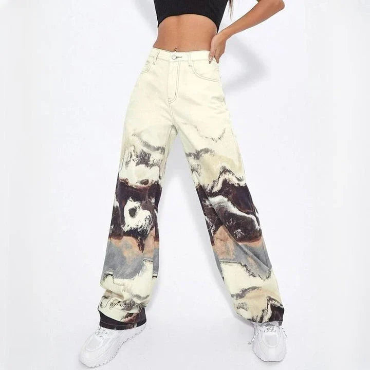 Stylish tie-dye wide-leg high-waist jeans in various sizes, featuring a unique colorblock design and premium denim fabric.