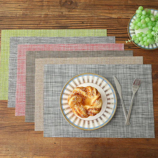Stylish and durable waterproof placemats in black, protecting a dining table from spills and stains