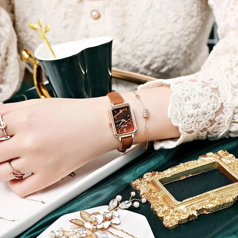 Refined square dial ladies watch with genuine leather strap, minimalist design, and durable aluminium alloy case