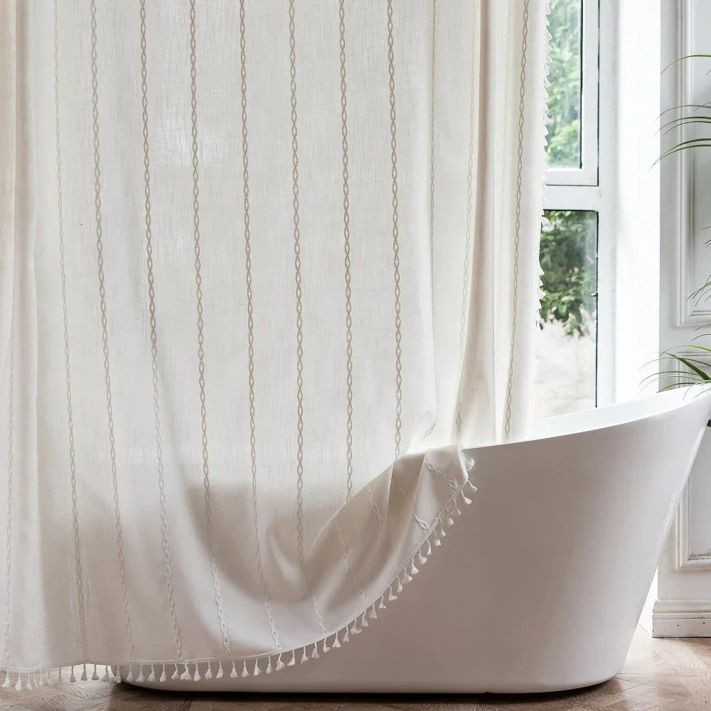 Premium bohemian tassel shower curtain with unique stitching design, waterproof coating, and durable linen blend material for a relaxing bathroom oasis