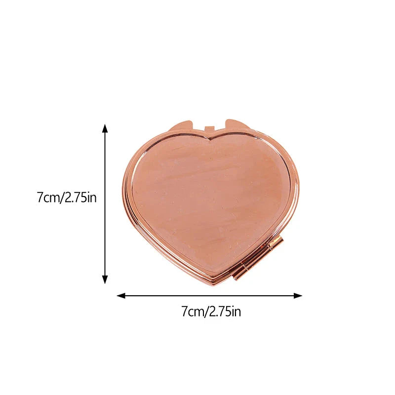 Elegant heart-shaped metal pill box with mirror for organized storage and convenient touch-ups