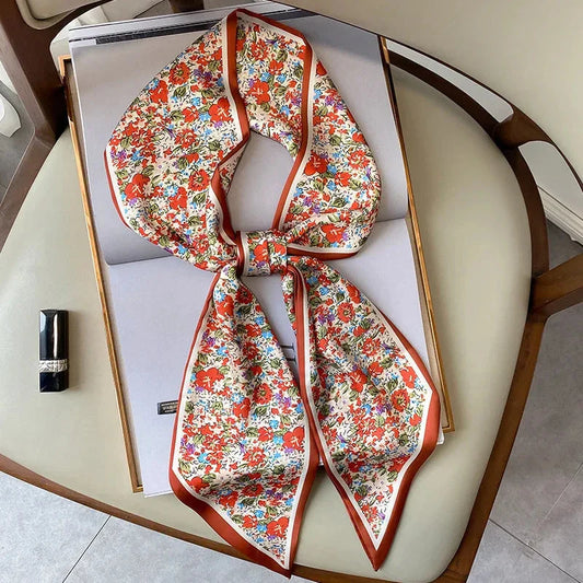 Elegant floral print polyester scarf with a soft, cotton-like texture for versatile seasonal wear