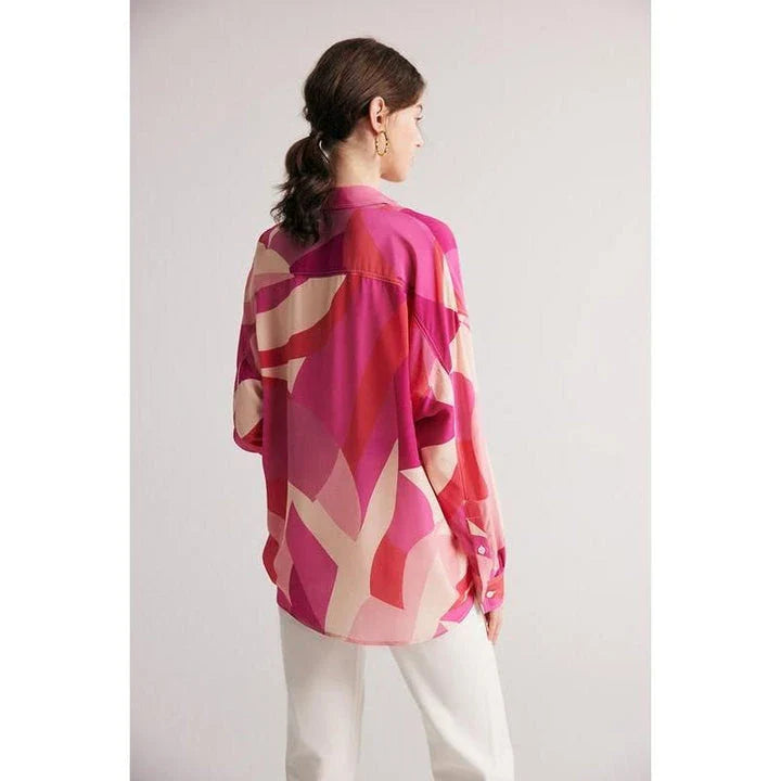 Elegant silk crepe de chine blouse in a unique print design, featuring a loose, straight fit and classic collar for a sophisticated yet comfortable look.