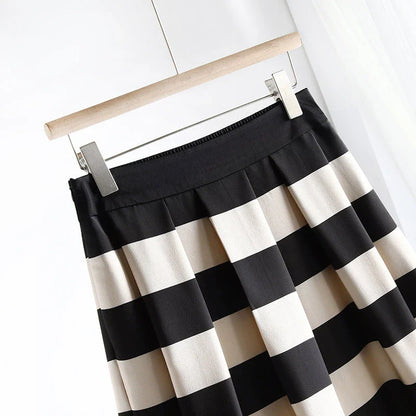 Elegant striped midi skirt with pleated design, made from premium polyester for a sophisticated and comfortable look.