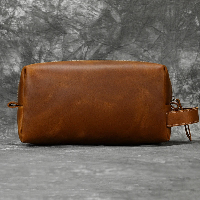 Premium leather clutch bag with multiple interior pockets, designed for the sophisticated British gentleman