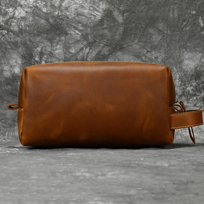 Premium leather clutch bag with multiple interior pockets, designed for the sophisticated British gentleman