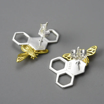 Elegant sterling silver beehive-inspired stud earrings with a nature-inspired design, perfect for fashion-conscious women