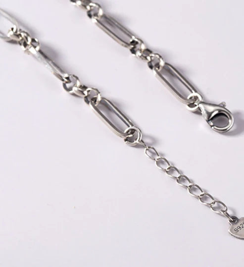 Elegant sterling silver bracelet with a delicate heart charm, a timeless accessory for the modern British woman.