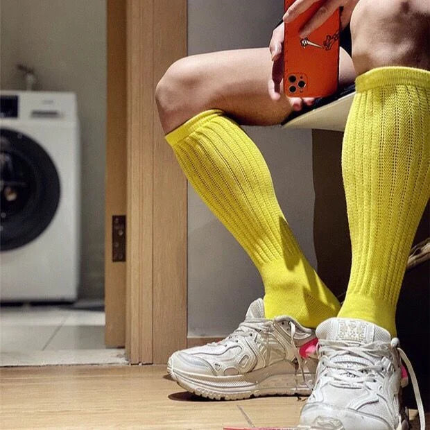 Premium men's breathable terry socks in various solid colours, offering superior moisture-wicking and comfort