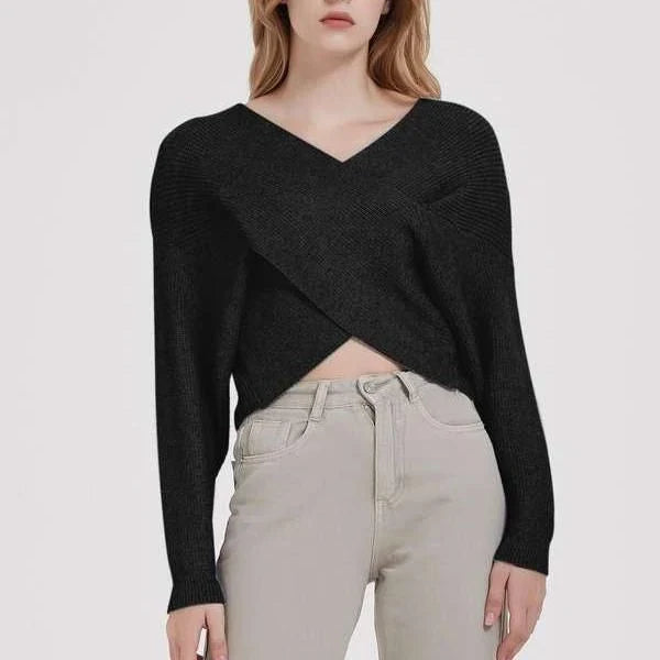 A cosy, brown V-neck knitted jumper with a relaxed, comfortable fit and a touch of vintage-inspired style.