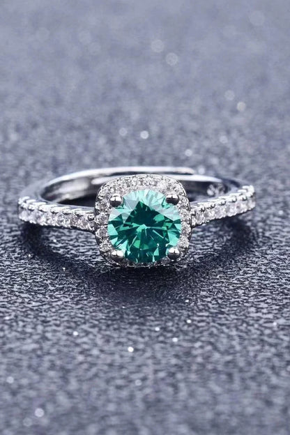 Close-up image of a modern 3 carat moissanite platinum-plated cluster ring with a minimalist design