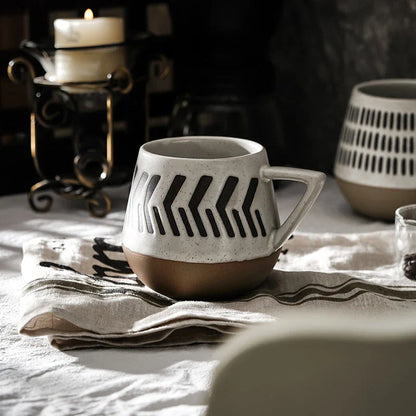 A hand-painted ceramic mug featuring a unique Nordic-inspired design, perfect for enjoying coffee, tea, or other beverages
