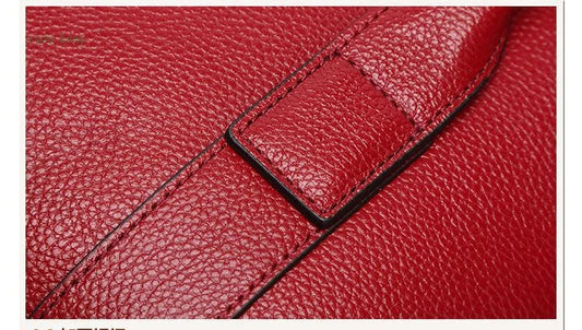 Premium first-layer cowhide leather shoulder bag with adjustable strap, spacious interior, and classic fashion design