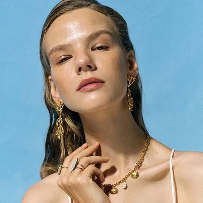 Elegant 18K gold plated coral pearl pendant earrings with a secure stud closure and a tarnish-proof finish