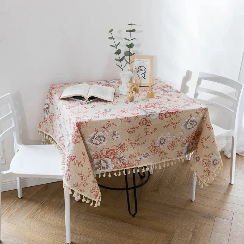Elegant peony print cotton linen tablecloth with tassels, perfect for sophisticated home decor and dining experiences