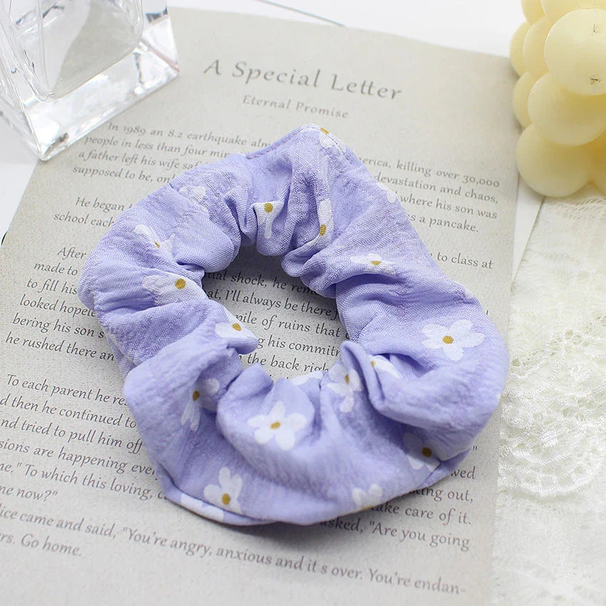 Handmade floral elastic hair bands with soft chiffon fabric and vibrant embroidered daisy patterns, perfect for enhancing everyday style in the UK.