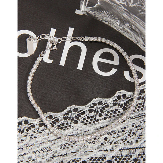 Sparkling silver geometric bracelet with adjustable clasp and intricate patterns