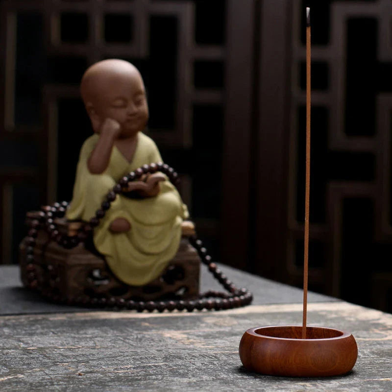 Elegant black sandalwood incense holder with four different caliber sizes to accommodate various incense sticks