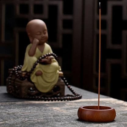 Elegant black sandalwood incense holder with four different caliber sizes to accommodate various incense sticks