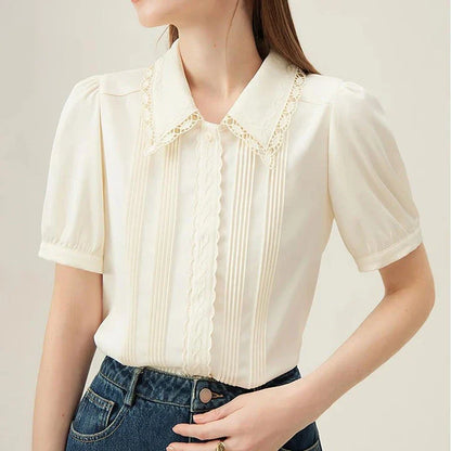 Elegant embroidered polo-neck blouse with petal sleeves, perfect for British summer fashion