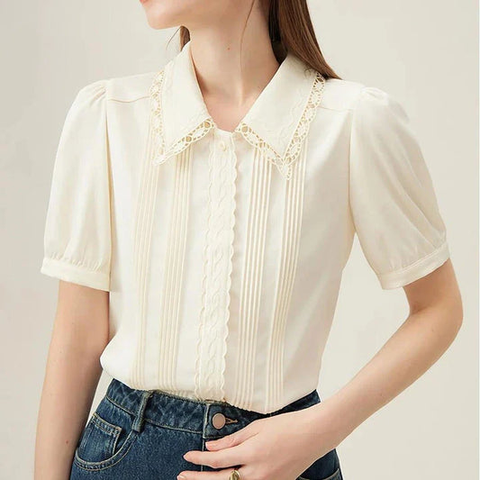 Elegant embroidered polo-neck blouse with petal sleeves, perfect for British summer fashion
