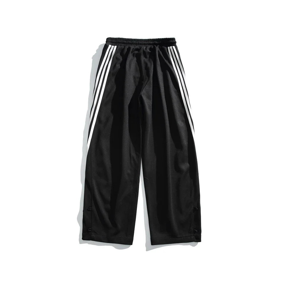 Stylish striped sports trousers in a relaxed, mid-waist design for versatile leisure and athletic wear