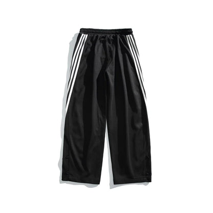 Stylish striped sports trousers in a relaxed, mid-waist design for versatile leisure and athletic wear