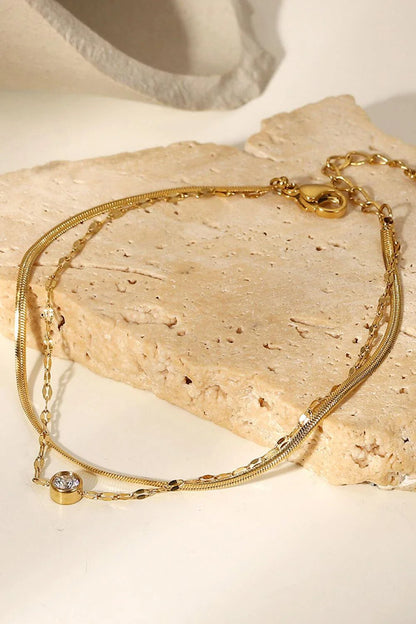 Exquisite rhinestone double-layered bracelet in gold finish, a premium stainless steel accessory with an adjustable design for a customised fit.